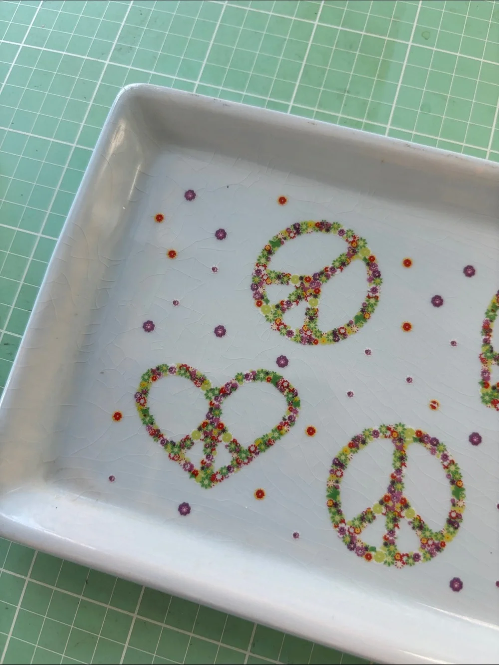 Boston Warehouse White Trinket Tray with Multicolor Peace & Heart Motifs